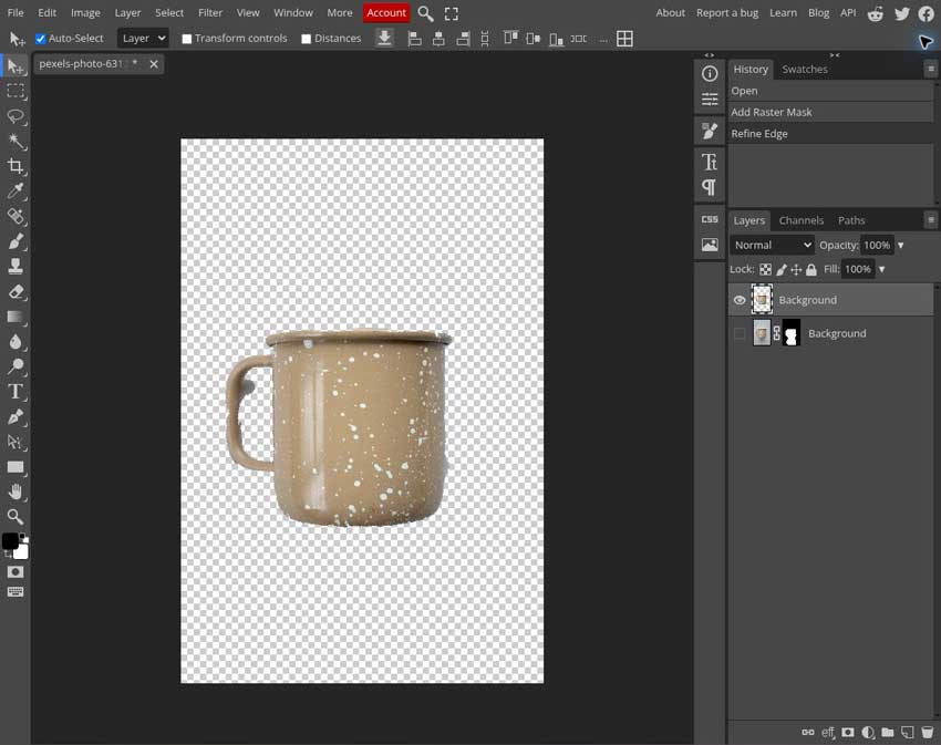 Mug cutout in the Photopea editor with checkerboard transparency around the object and inside its handle