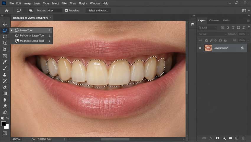 Select the teeth with the Lasso Tool in Photoshop